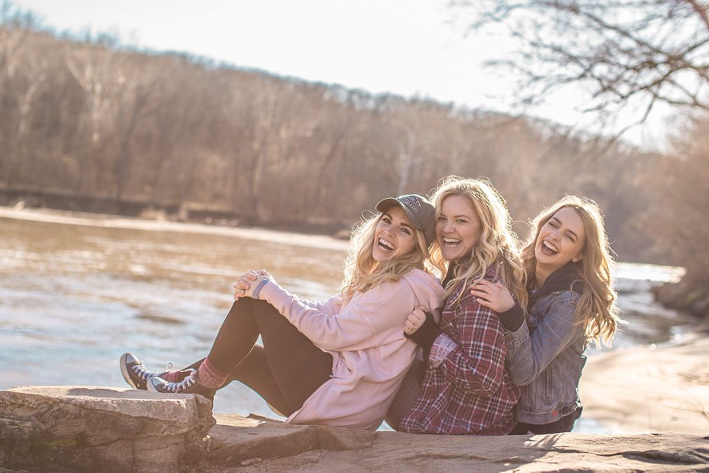 girls laughing by the river